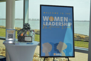 the registration area of the 7th annual women in leadership event by the mba
