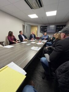 ism group talking during manufacturing facility tour